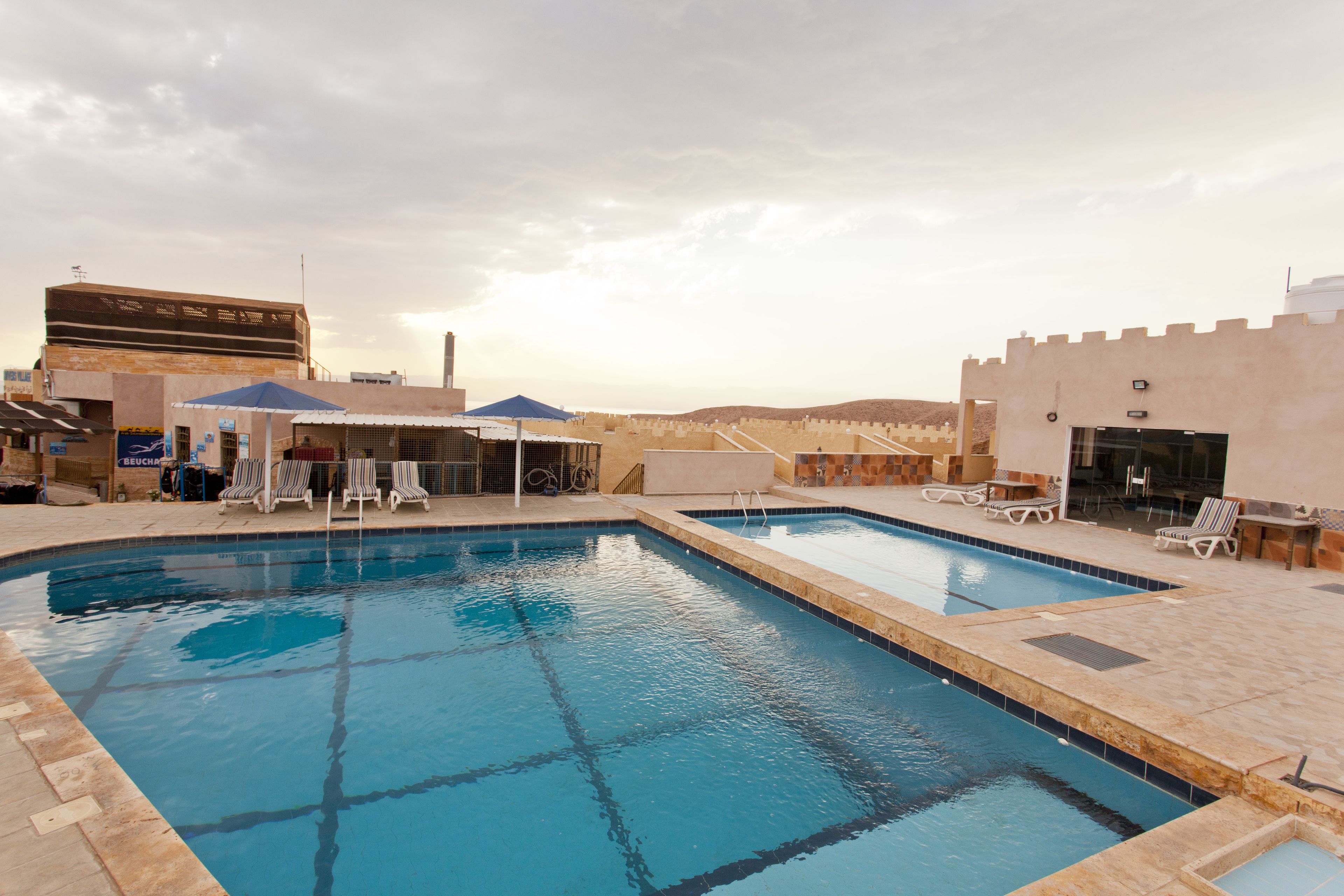 outdoor pool, pool umbrellas, pool loungers