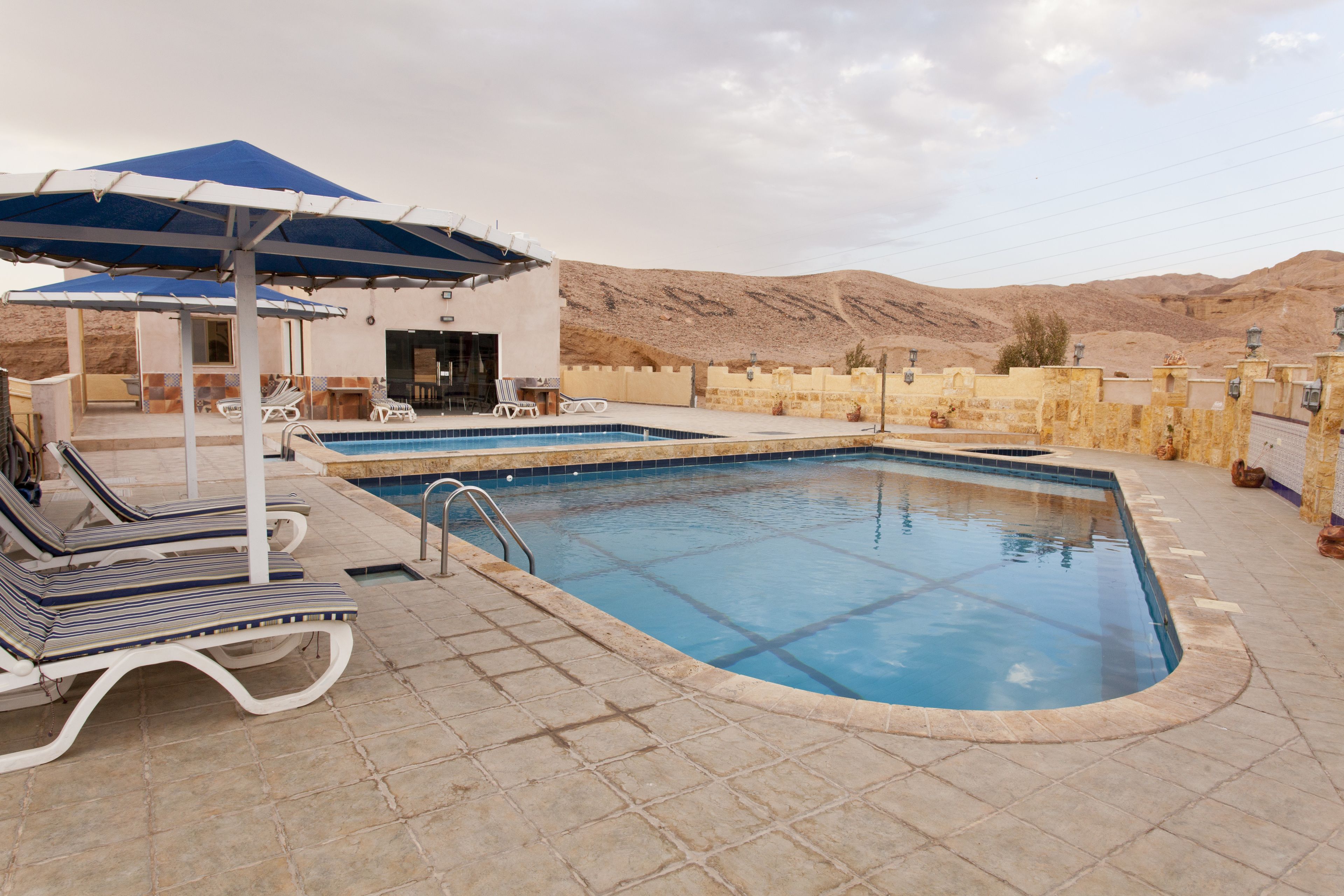 outdoor pool, pool umbrellas, pool loungers