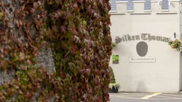 A building with a sign reading "Silken Thomas" and "Accommodation".