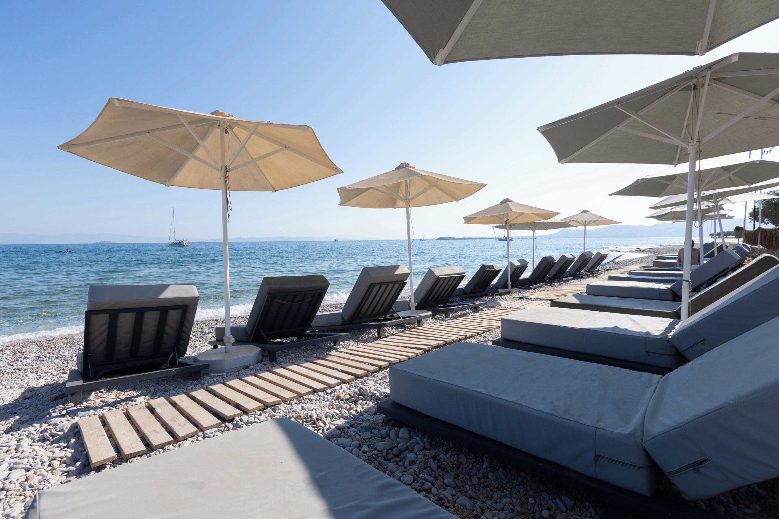 On the beach, sun loungers, beach umbrellas, beach bar