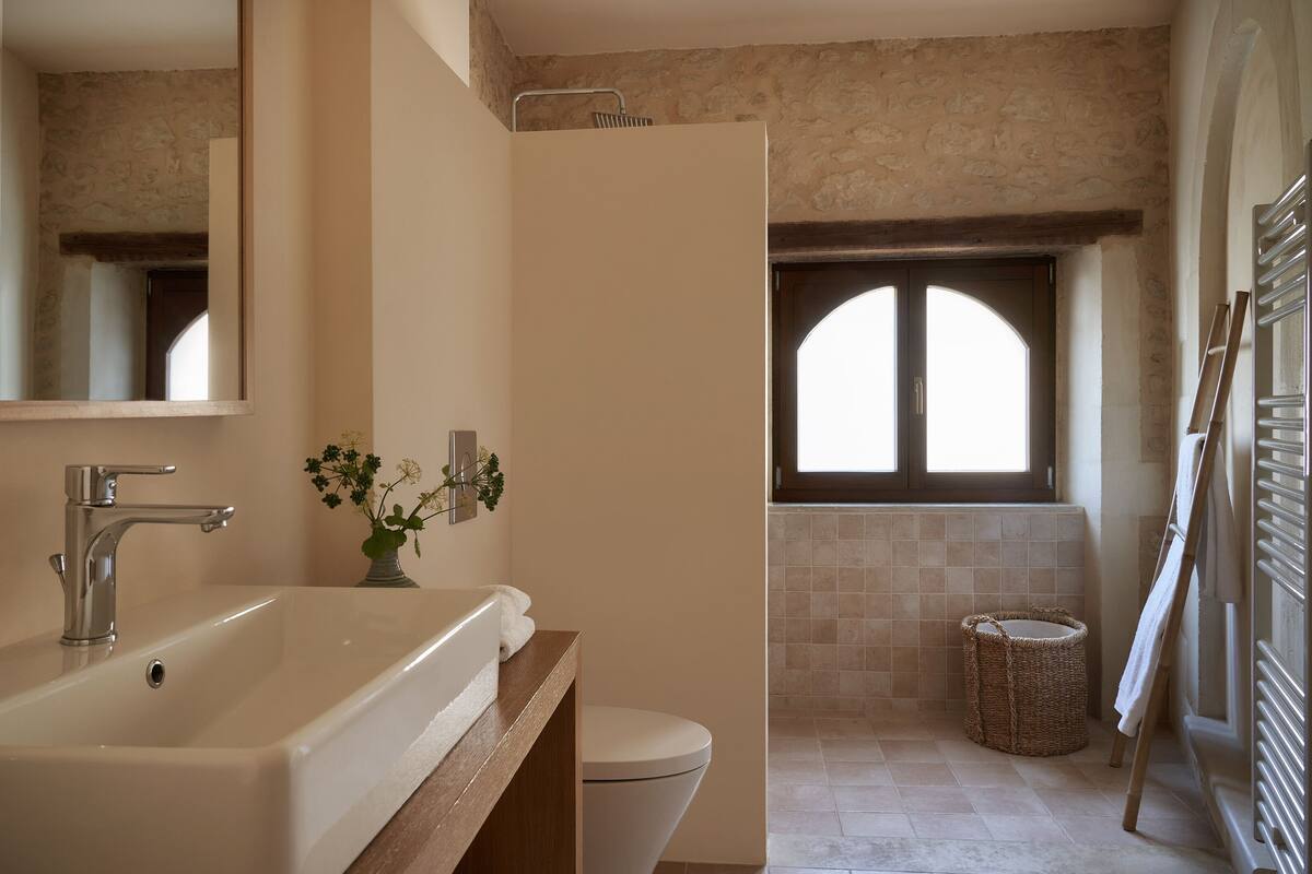 historic olive mill suite | bathroom | shower, rainfall showerhead, designer toiletries, hair dryer