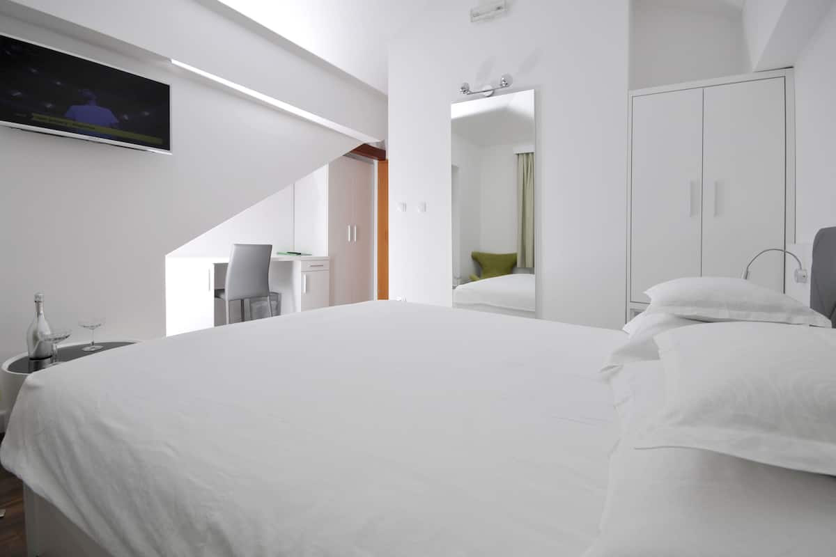 standard double room, city view | premium bedding, minibar, in-room safe, individually decorated