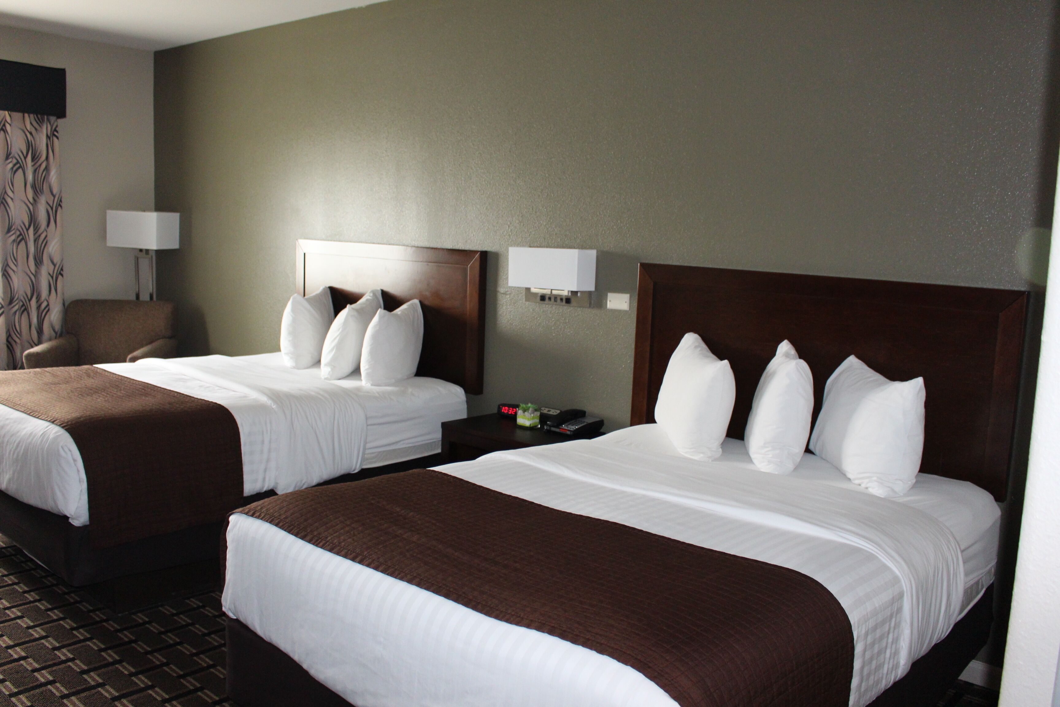 deluxe room, 2 queen beds, non smoking | desk, blackout curtains, iron/ironing board, free cots/infant beds