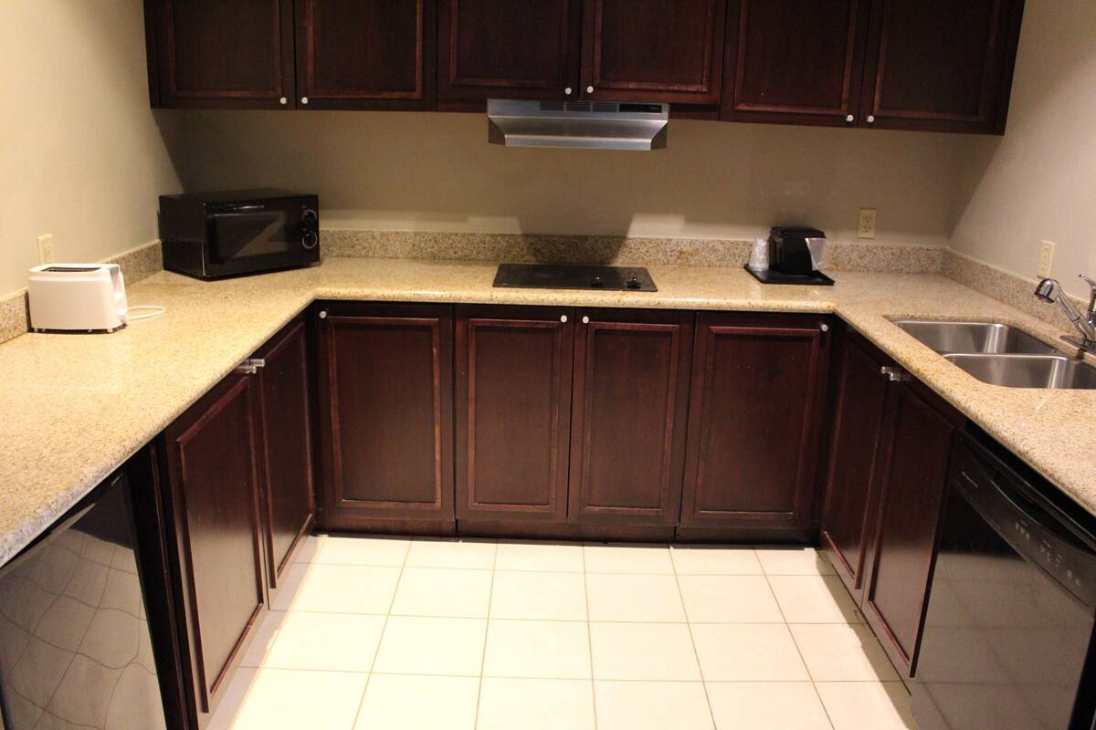 suite, 1 bedroom, non smoking, kitchen | desk, blackout curtains, iron/ironing board, free cots/infant beds