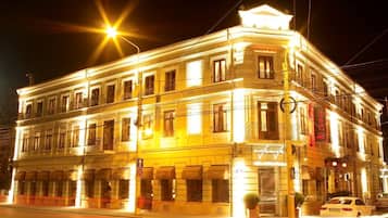 Classic hotel entrance with a historic corner building.