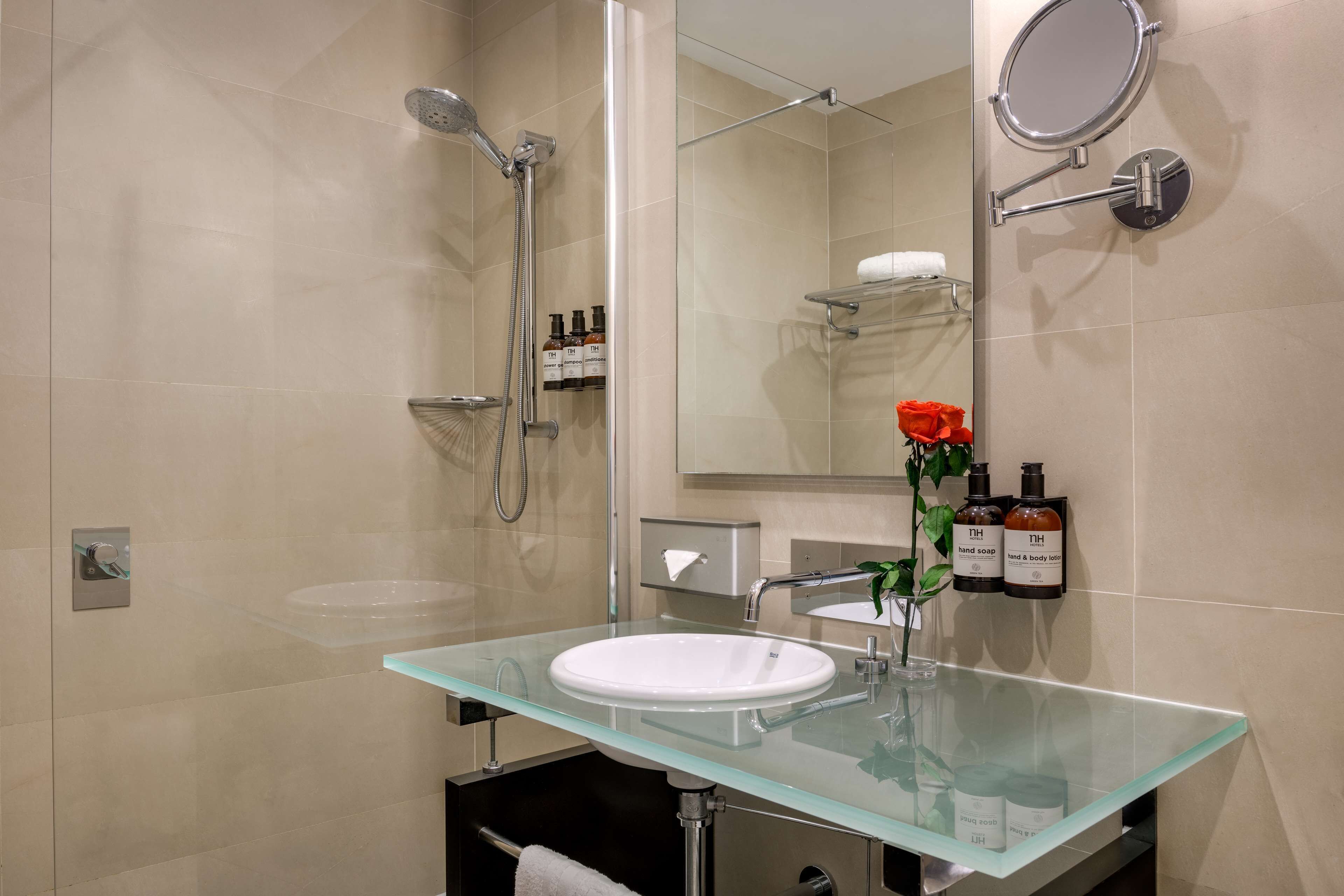 bathtub, rainfall showerhead, eco-friendly toiletries, hair dryer