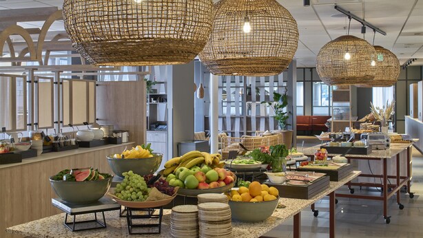 A buffet setup with various fruits, vegetables, and cheeses. - Scandic Karlskrona (Karlskrona)