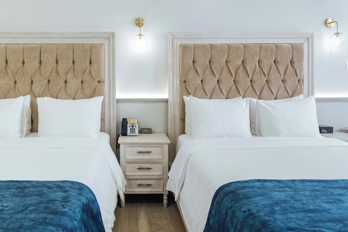 Suite, 2 Queen Beds | In-room safe, blackout drapes, soundproofing, WiFi (free)