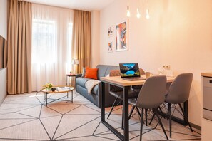 Premier Apartment | Living area | 50-inch Smart TV with digital channels, TV - City Park Apart Hotel (Kyiv)