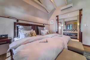 Deluxe Room | Minibar, in-room safe, individually decorated, desk