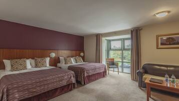 Family Room | Premium bedding, down comforters, in-room safe, desk