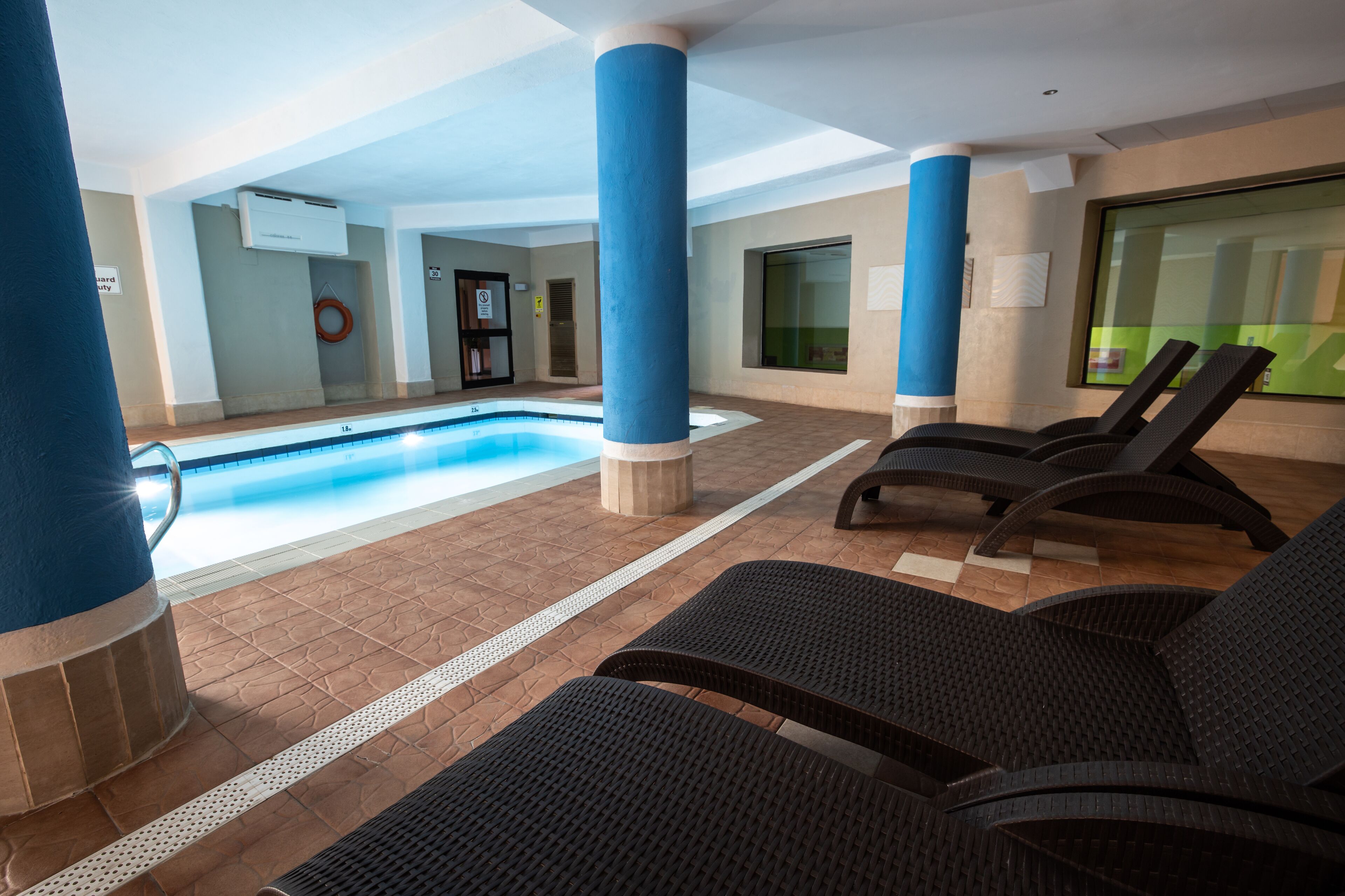 indoor pool, outdoor pool, pool umbrellas, pool loungers