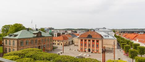 A historic building with a central courtyard, surrounded by trees and other buildings.