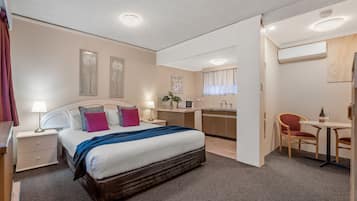 Queen Spa Suite | Premium bedding, blackout curtains, iron/ironing board, free WiFi