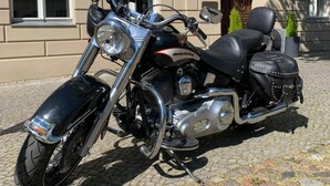 A motorcycle parked in front of a building with a sign that reads "Hotel". - Altstadt Hotel (Potsdam)