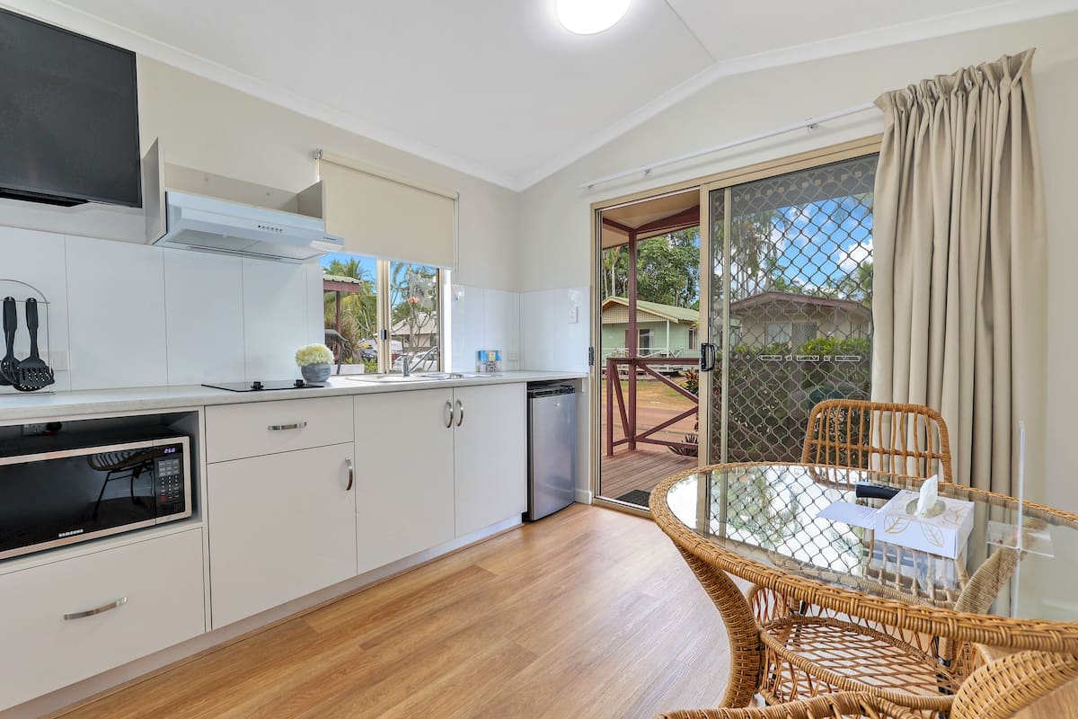 Fridge, electric kettle, dining tables