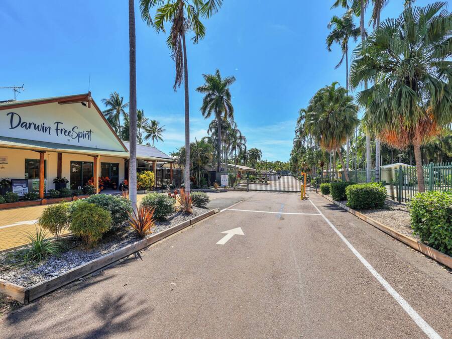 A street view with a building labeled "Darwin FreeSpirit."
