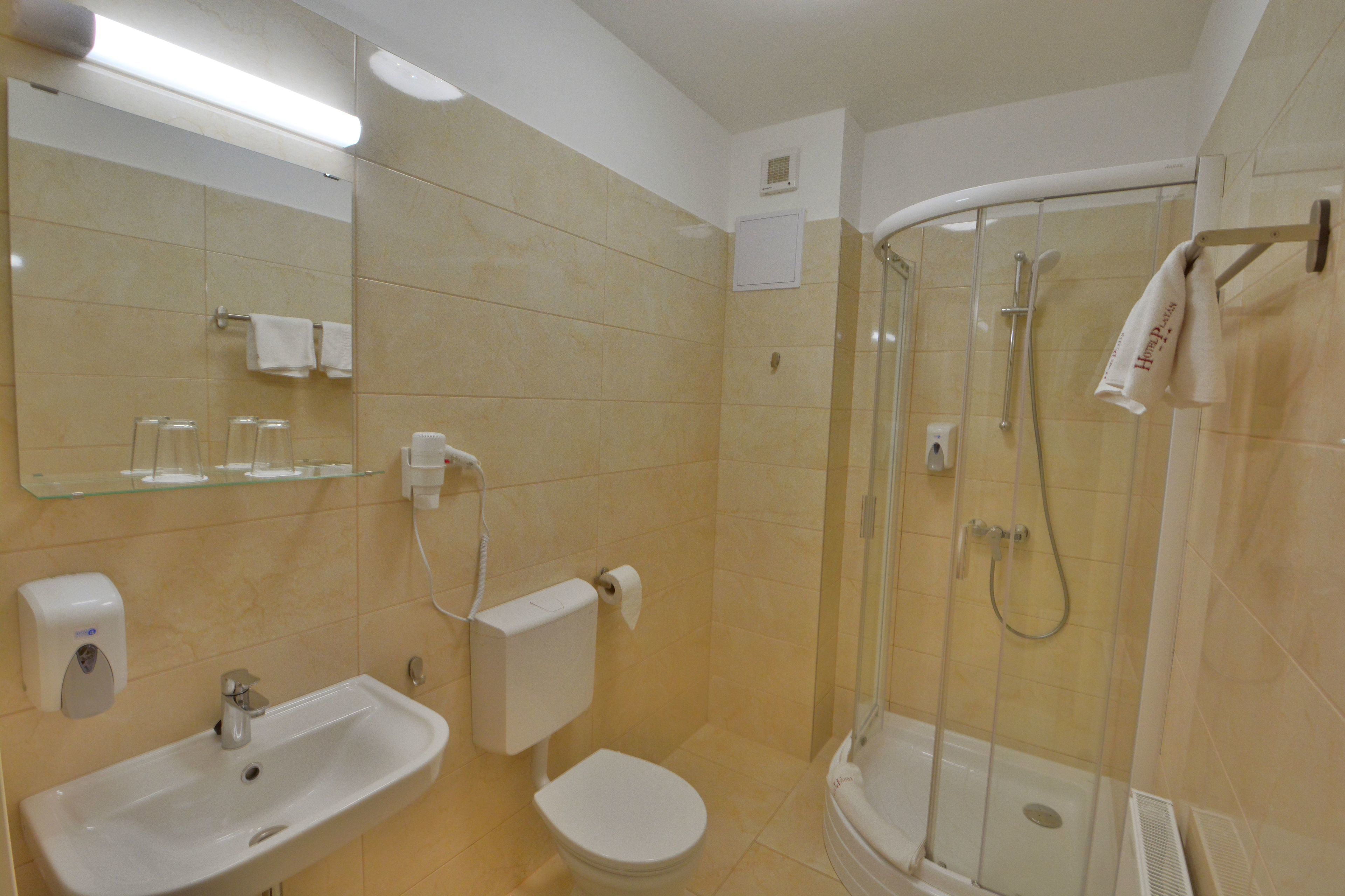 standard double or twin room | bathroom | shower, hair dryer, towels, soap