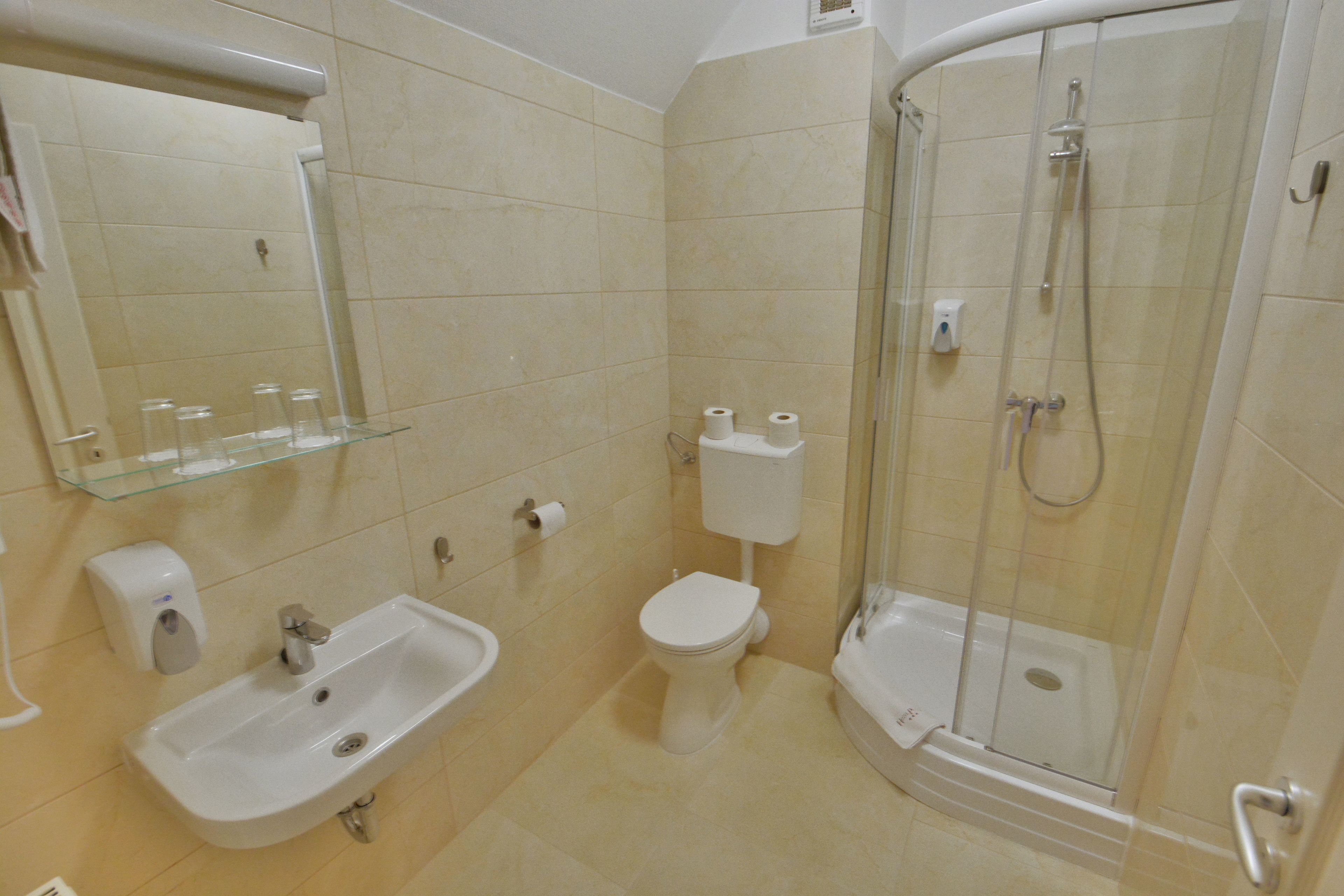 suite | bathroom | shower, hair dryer, towels, soap
