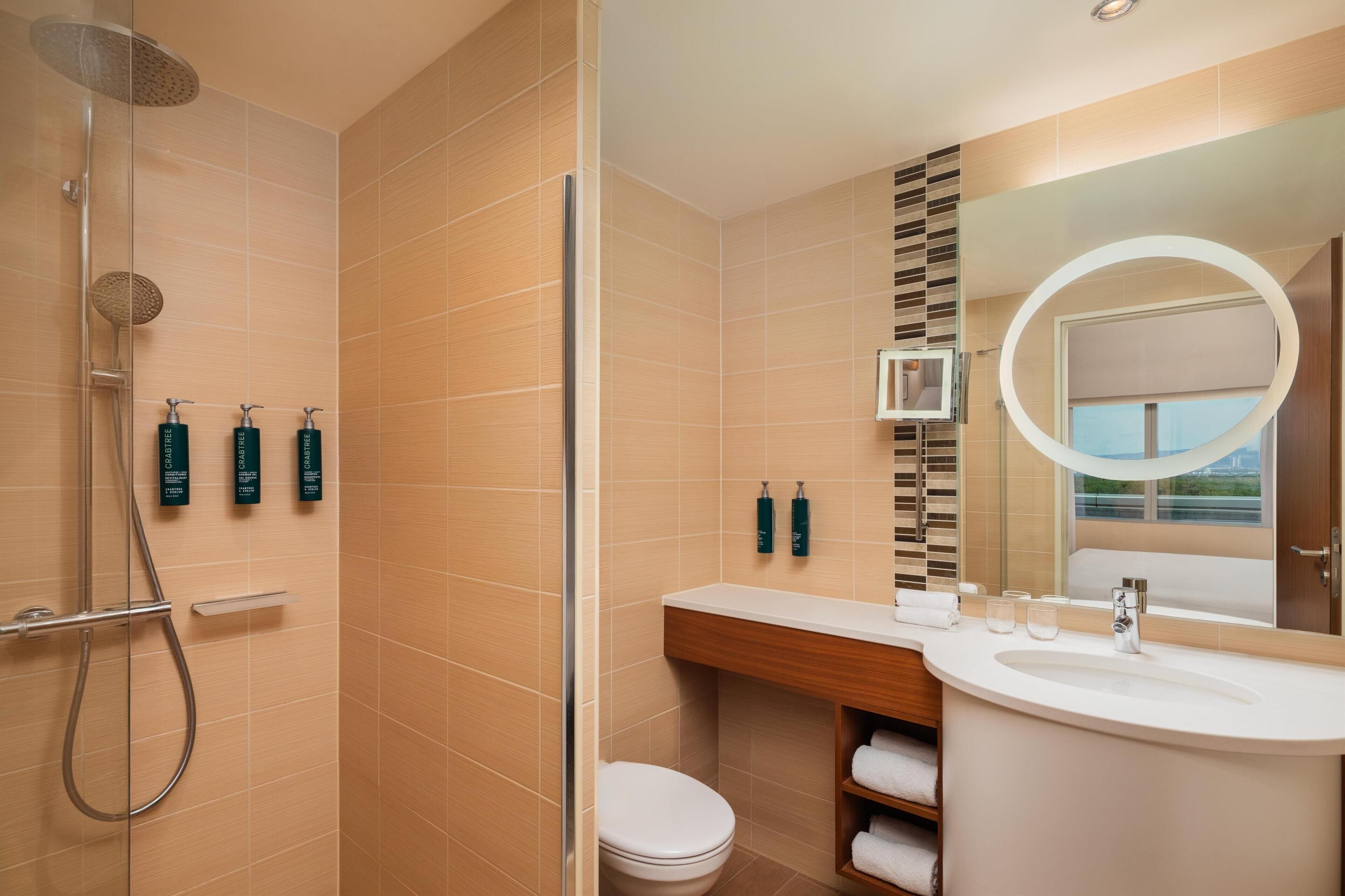 junior suite, 1 king bed | bathroom shower