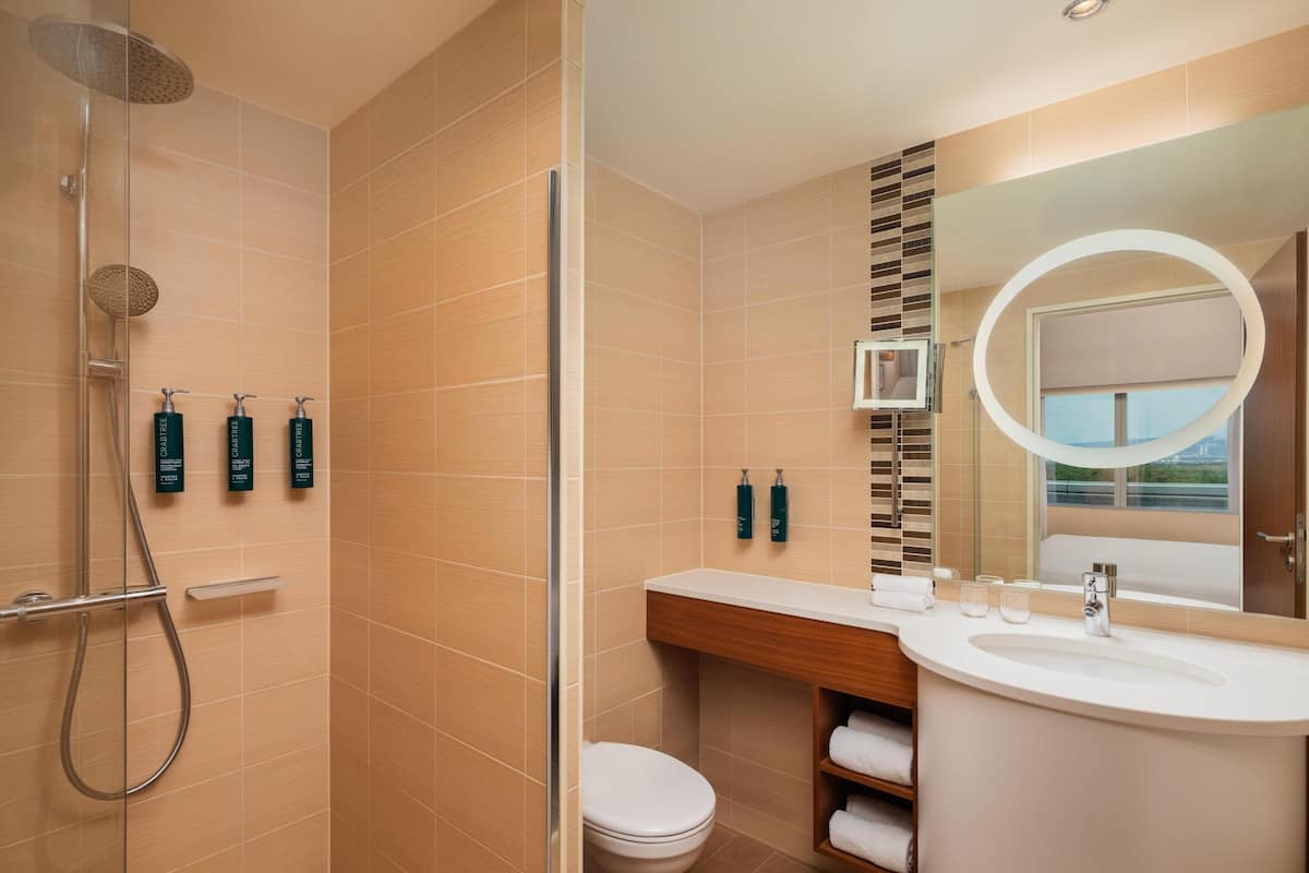 junior suite, 1 king bed | bathroom shower