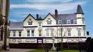 A large, historic building with multiple windows and a prominent tower. - Throstles Nest Hotel (Liverpool)