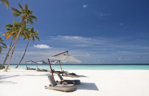 Private beach, white sand, free beach cabanas, sun loungers