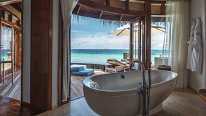 A large bathtub in a room with a view of the ocean. - Constance Halaveli (Halaveli)