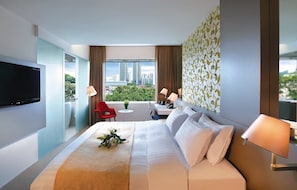 Relax in this stylish room with a large bed, flat-screen TV, and city view from the window.
