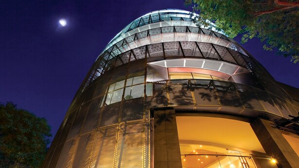 A modern building with a curved facade and a large glass entrance. - D'Hotel Singapore managed by The Ascott Limited (Singapore)