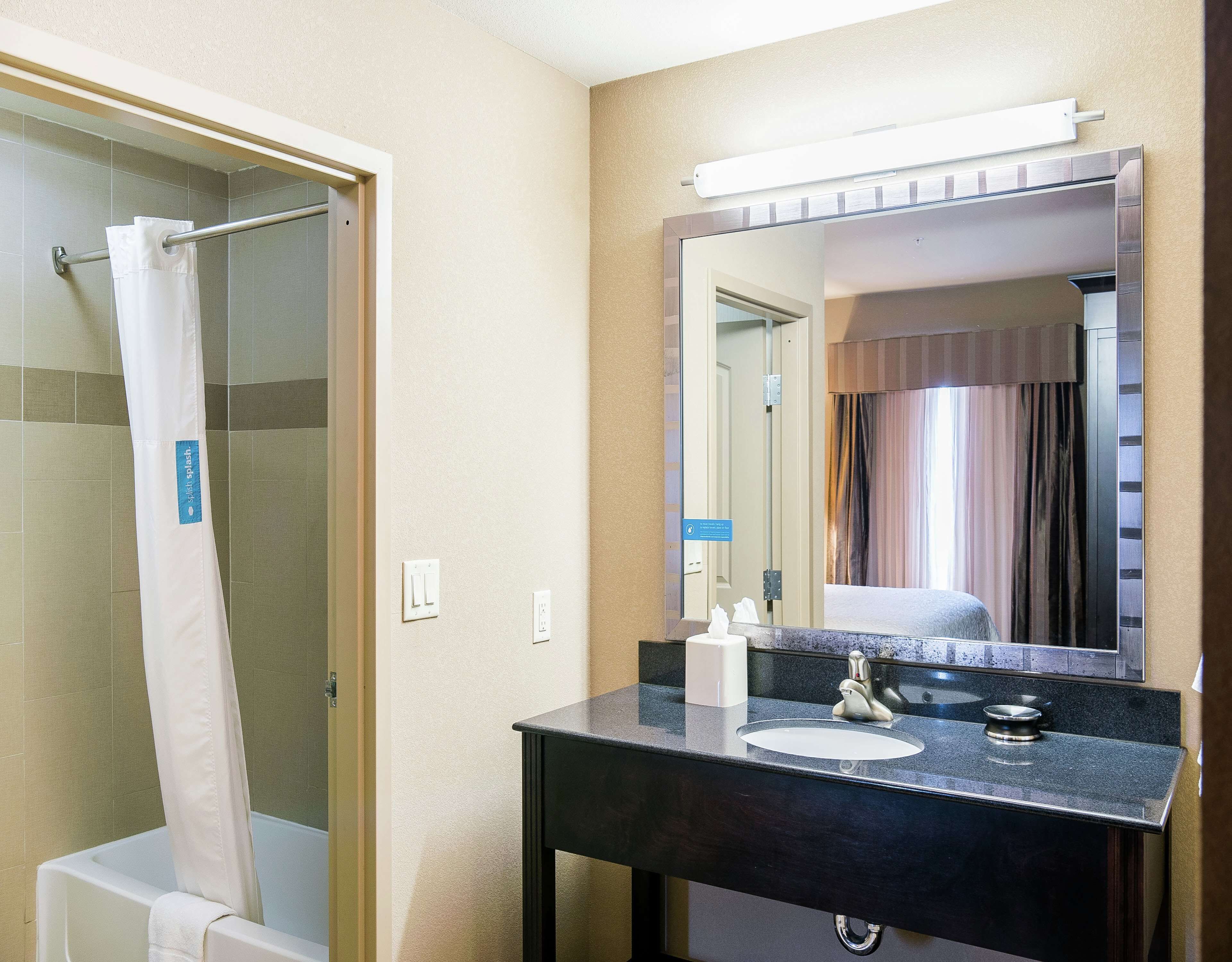studio suite, 1 king bed | bathroom | free toiletries, hair dryer, bathrobes, towels