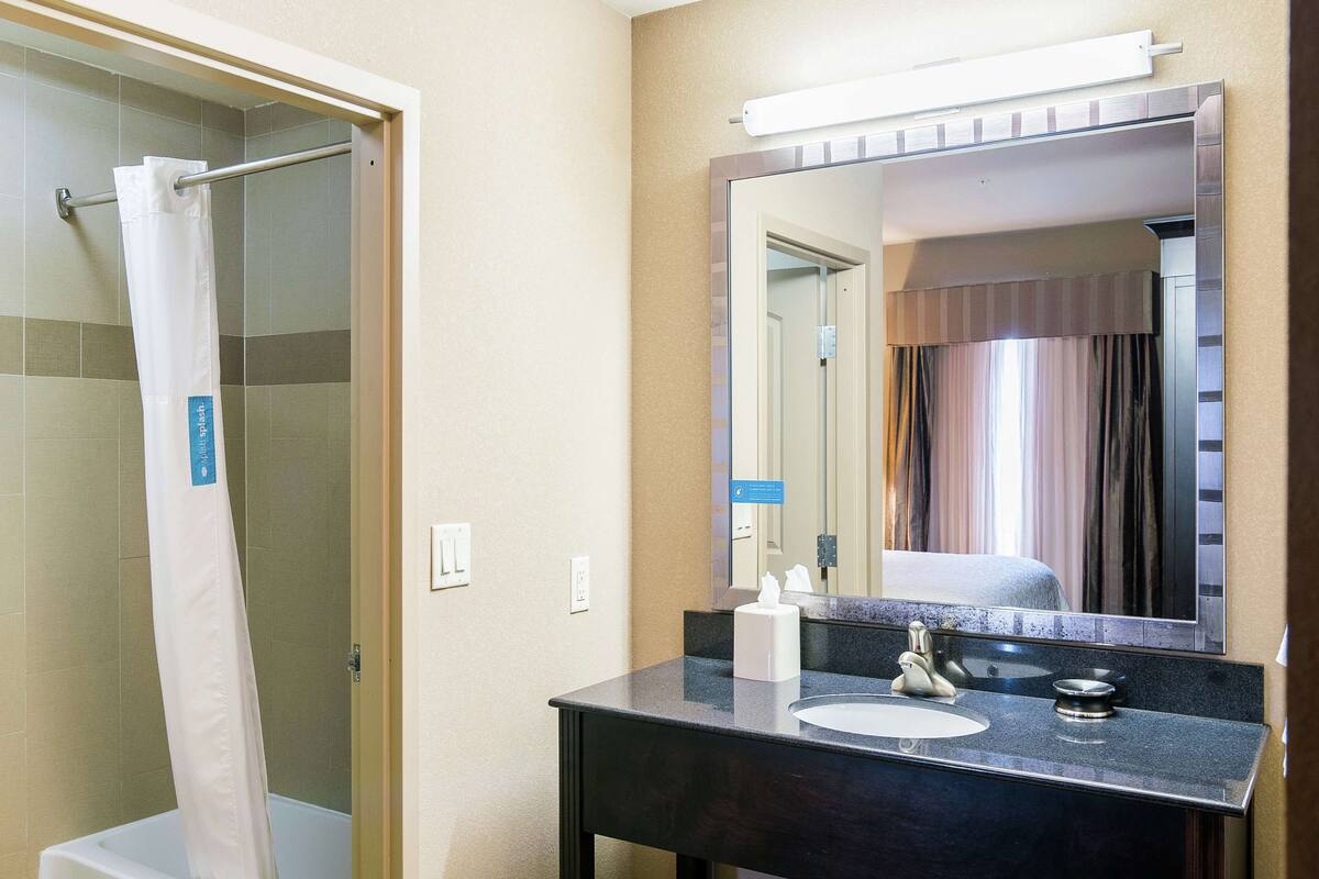 studio suite, 1 king bed | bathroom | free toiletries, hair dryer, bathrobes, towels