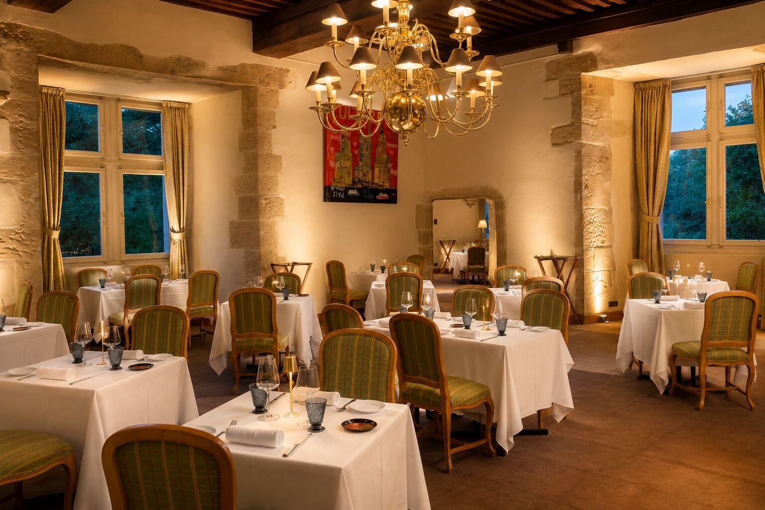 A dining area with multiple tables set for guests, featuring green upholstered chairs and white tablecloths.