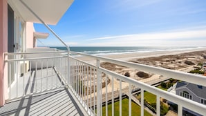 A balcony with a view of the beach and ocean. - Port-O-Call Hotel (Ocean City)