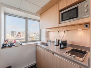 Appartement (Executive) | Cuisine privée | Réfrigérateur, micro-ondes, plaque de cuisson, lave-vaisselle