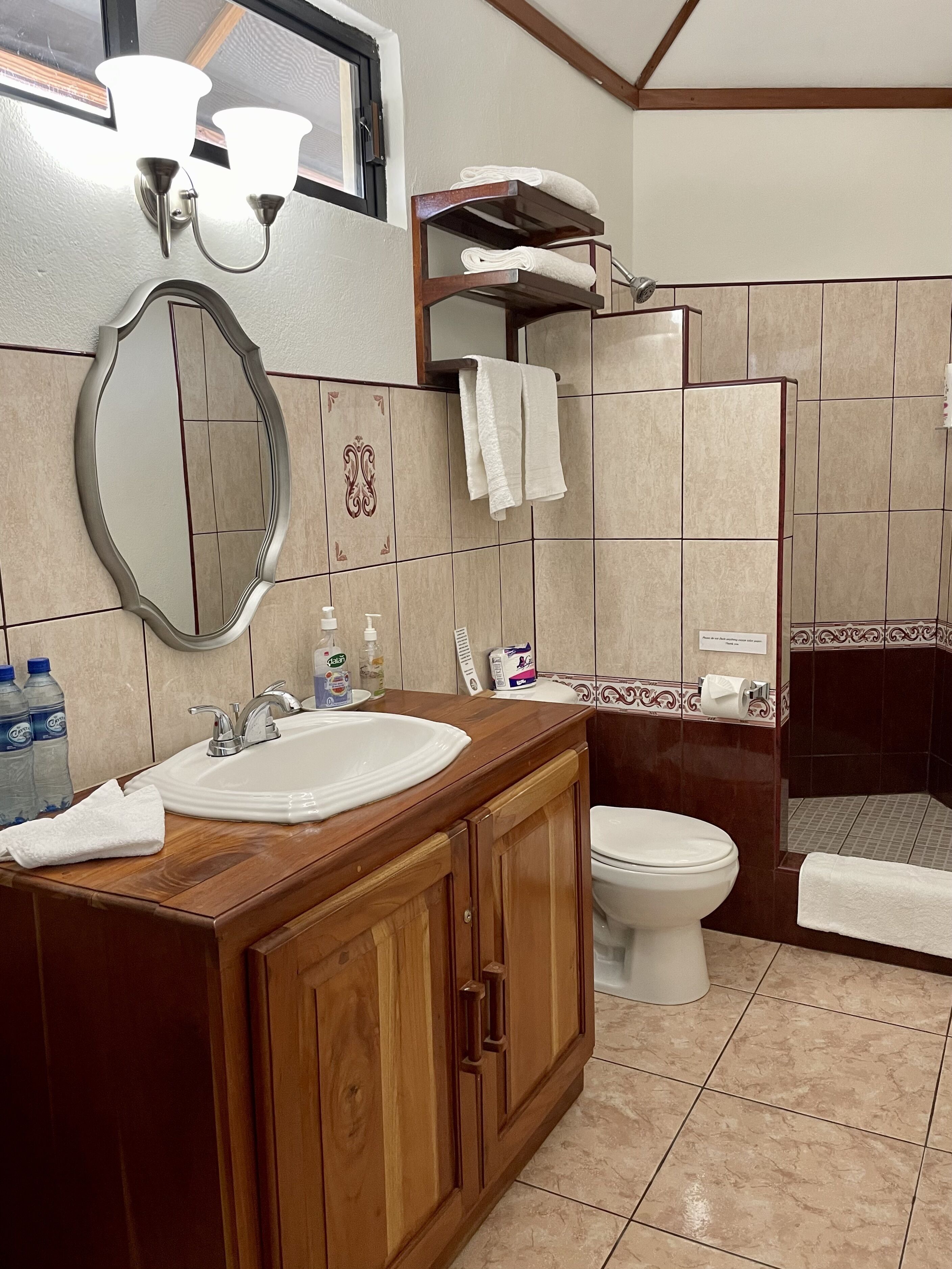 honeymoon cabin, 1 king bed, terrace | bathroom | shower, towels, soap, toilet paper