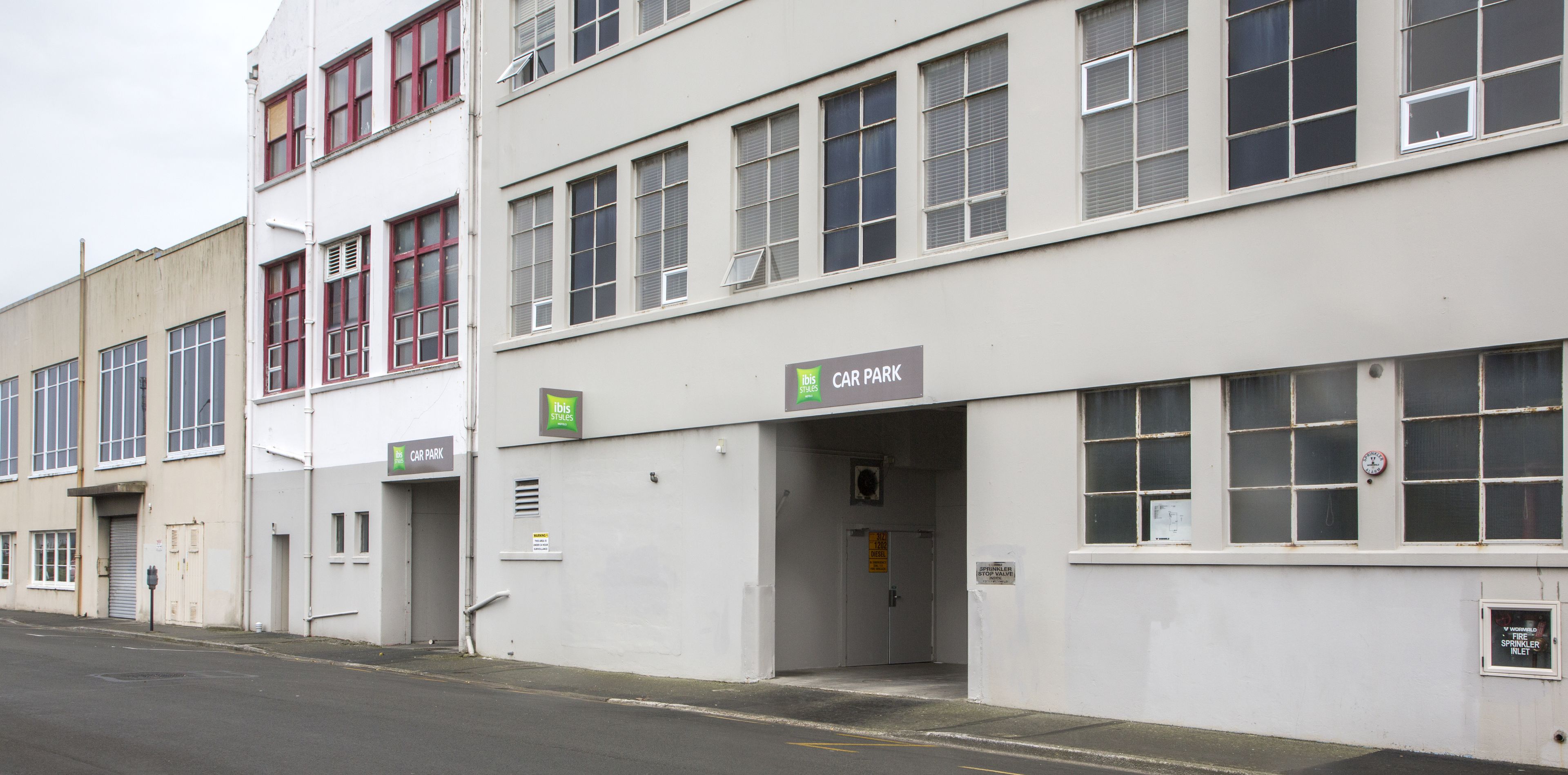 A building with a sign indicating a car park.