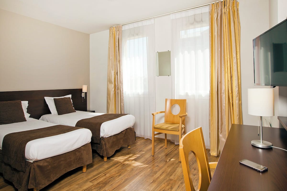 Premium Studio | Desk, laptop workspace, blackout drapes, iron/ironing board