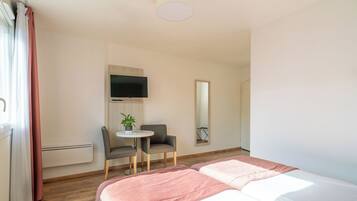 Premium Studio | Desk, laptop workspace, blackout drapes, iron/ironing board