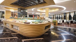 A modern hotel lobby with a central buffet area, marble flooring, and contemporary furniture. - Qinghe Jin Jiang International Hotel (Zhangjiajie)