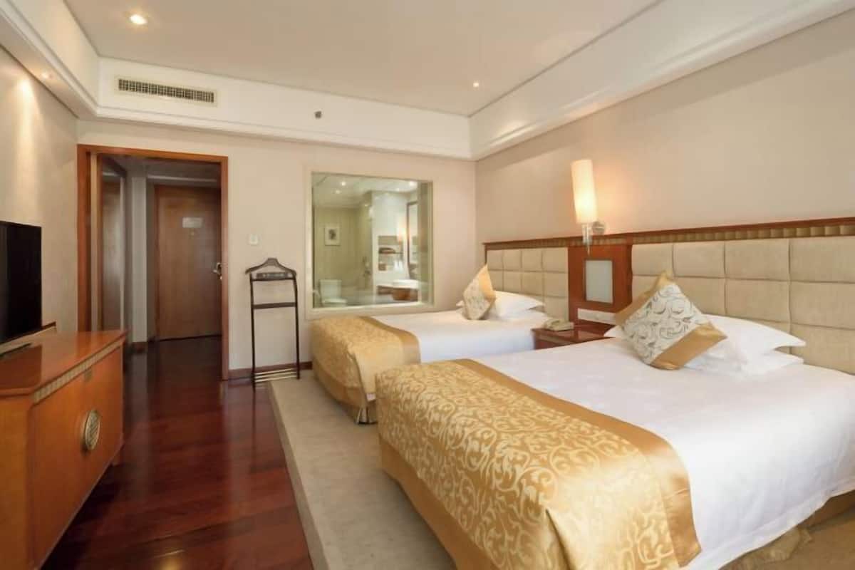 Premium bedding, down comforters, memory foam beds, minibar