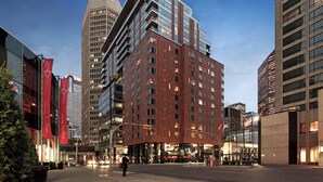 A modern urban hotel with multiple floors, large windows, and a prominent entrance. - Hotel Le Germain Calgary (Calgary)