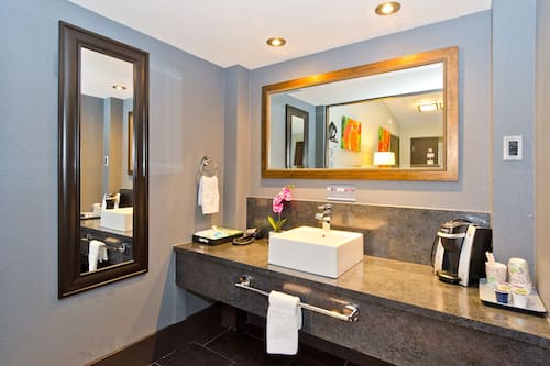 Shower, designer toiletries, hair dryer, bathrobes