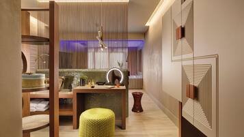 Une salle de bain moderne avec un meuble-lavabo en bois, un tabouret rond jaune et un miroir avec éclairage intégré.