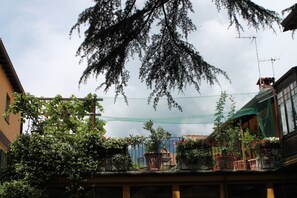 Enjoy an outdoor space with a balcony featuring lush greenery and a tranquil atmosphere.
