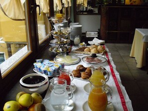 Enjoy a sumptuous breakfast spread with a variety of pastries, fresh fruits, and refreshing beverages.
