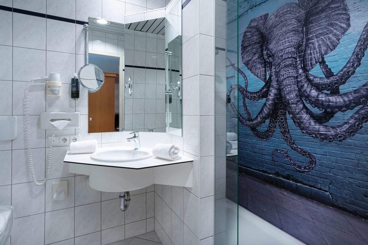 eco-friendly toiletries, hair dryer, towels, soap