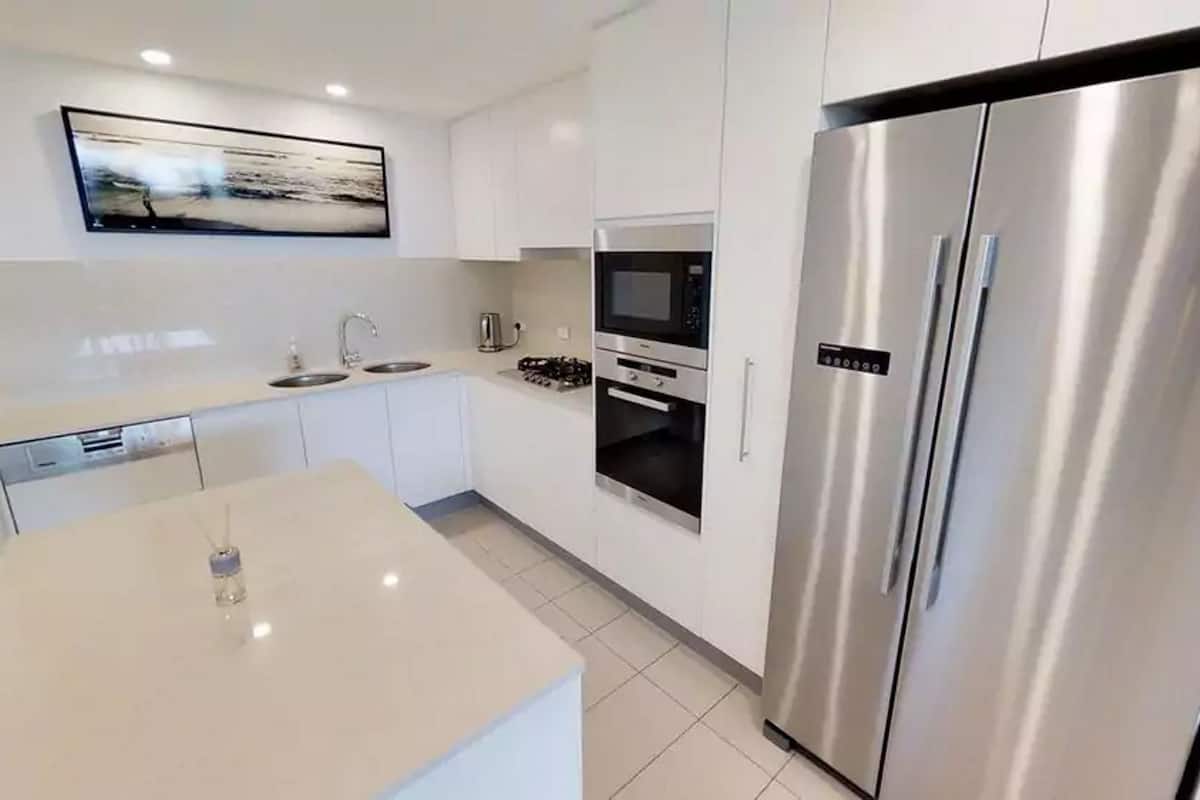 full-sized fridge, microwave, stovetop, dishwasher