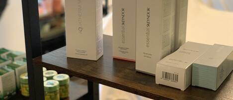 A shelf with several boxes labeled 'AQUATHERM SKYNDOR' and 'essential SKYNDOR'.