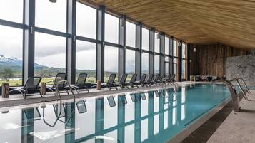 Indoor pool, open 9:00 AM to 10:00 PM, pool loungers